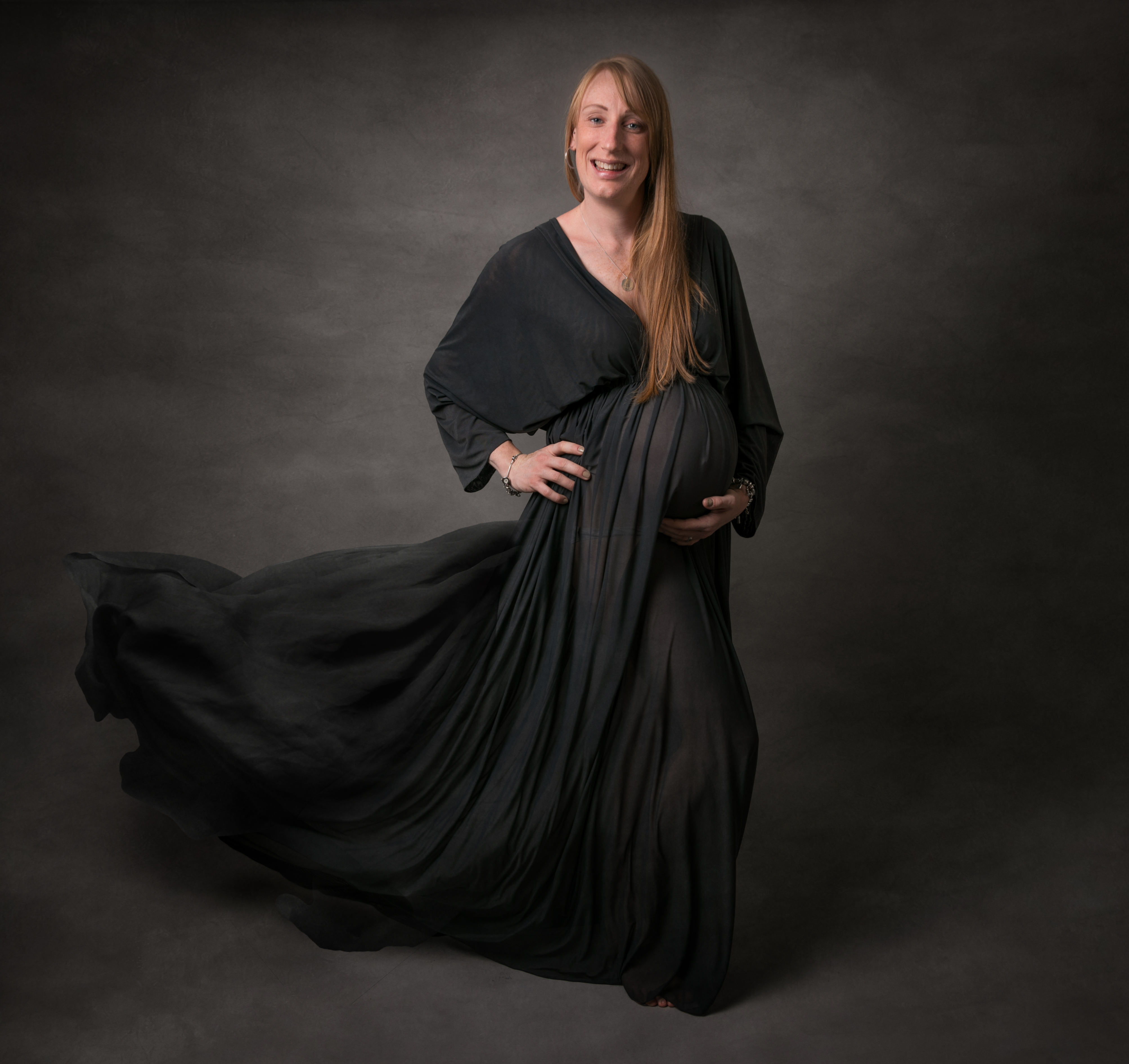 Pregnany lady in grey dress